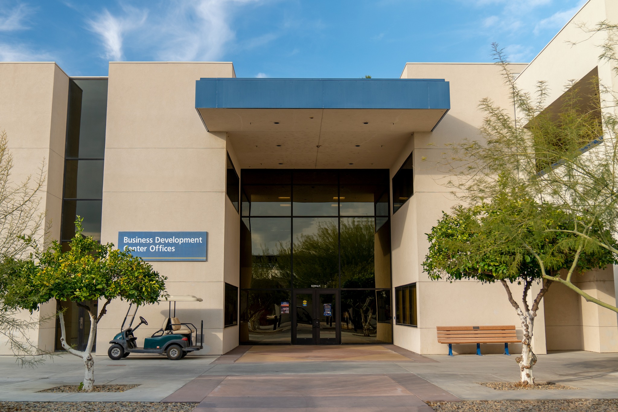 Façade of the Business Development Center Offices at California State University, Bakersfield, with glass doors