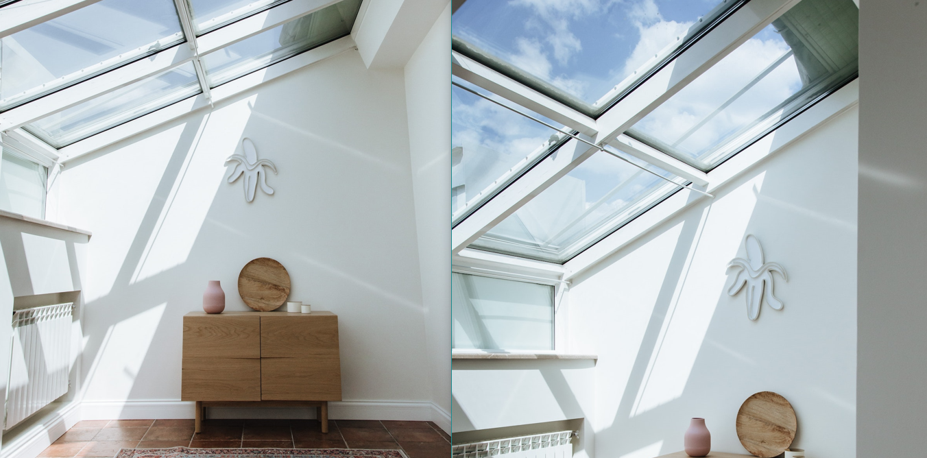 Room with wooden table, half-peeled banana wall décor and large glass panels forming a part of its roof