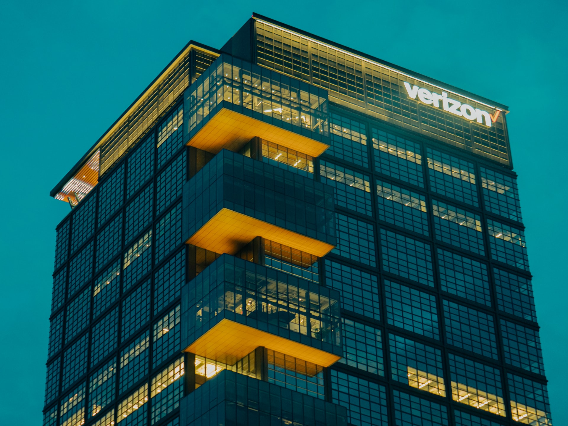 Verizon building in Boston, Massachusetts at night, with protruding offices on the corner