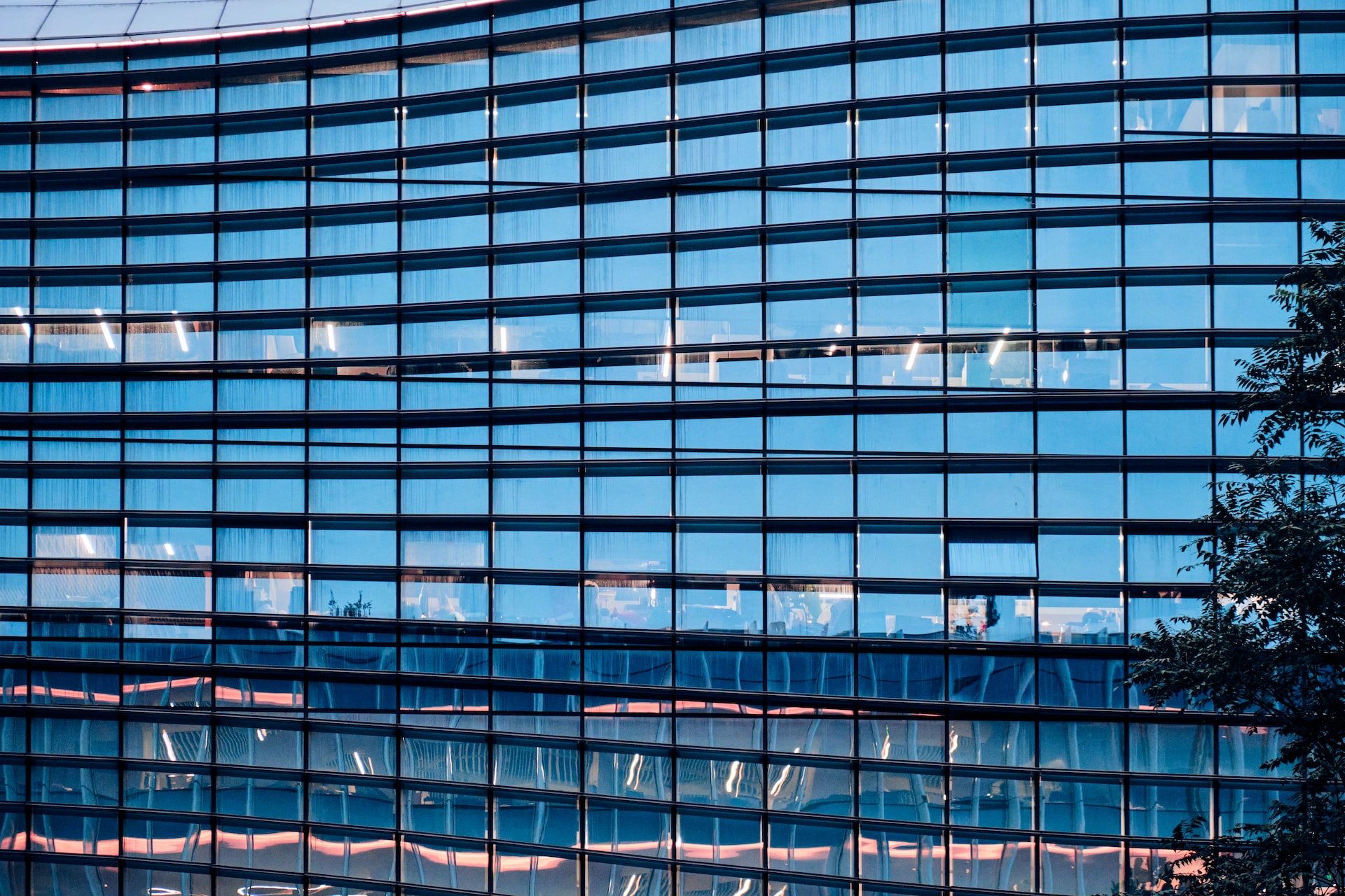 Rectangular glass panels of reflecting blue colors of the SINA building in Beijing, China
