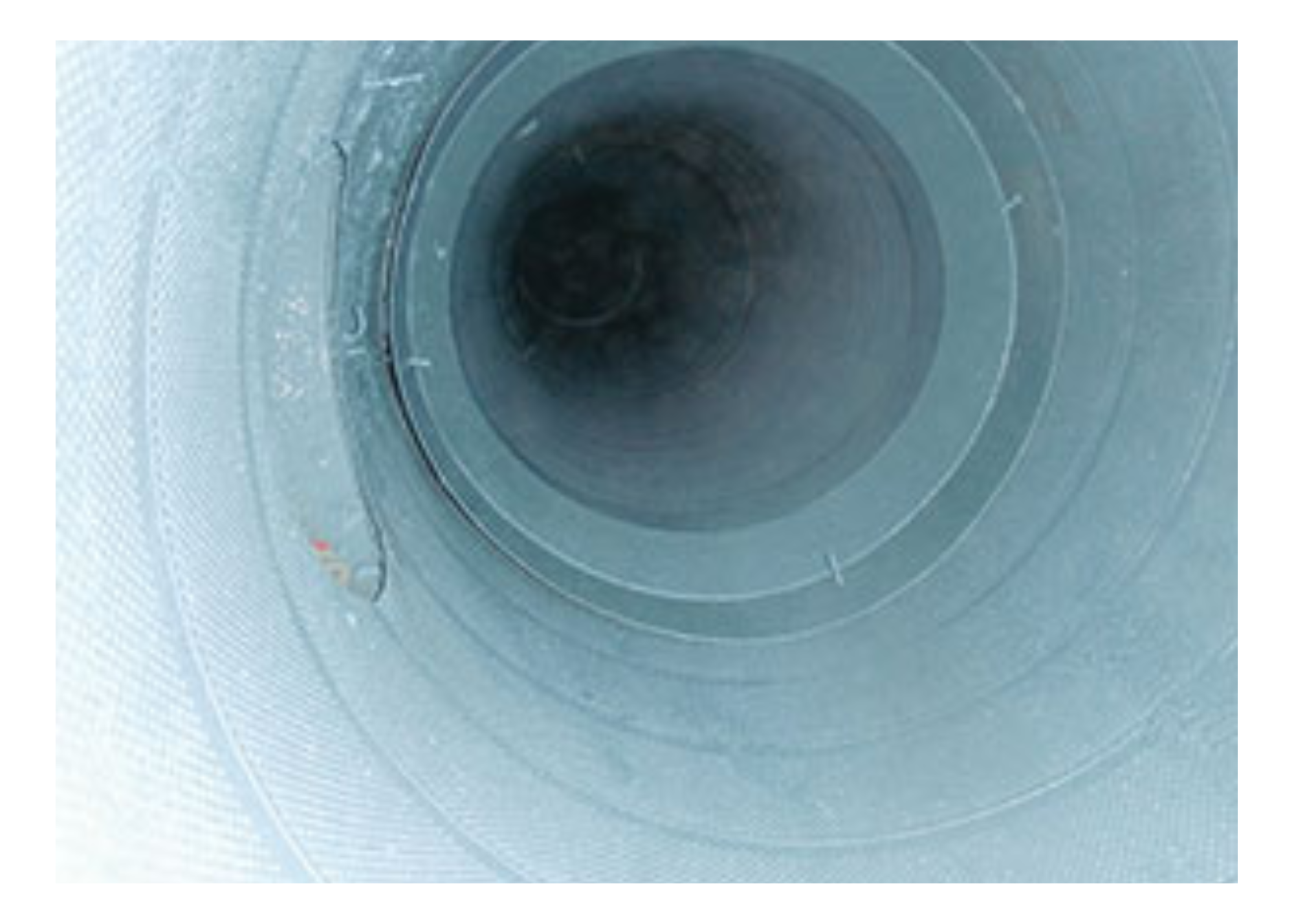 After ISAAC cleaned the facility’s ductwork (above), removing dirt and debris in a single pass, it was then used to apply a water-based duct sealant (below) engineered to seal joints and seams from inside the ductwork