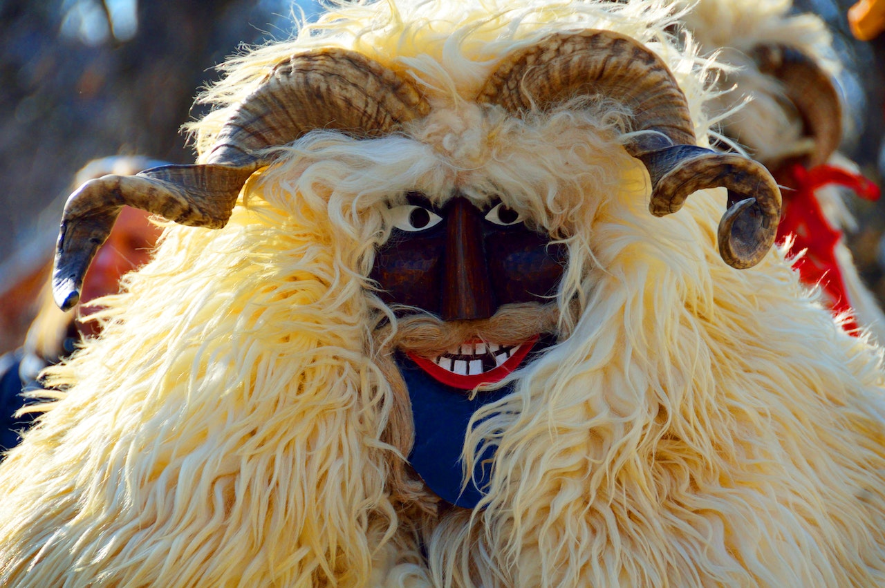 Person Wearing a Traditional Busó Carnival Mask in Mohács