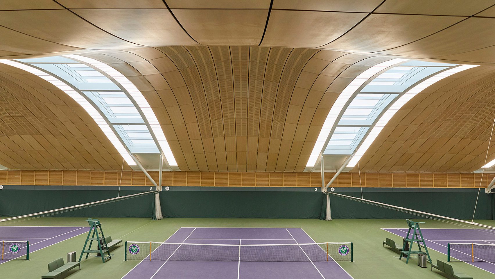 British Studio Hopkins Architects Unveils Stunning Indoor Tennis Centre With Undulating Timber-Coated Roof At Wimbledon