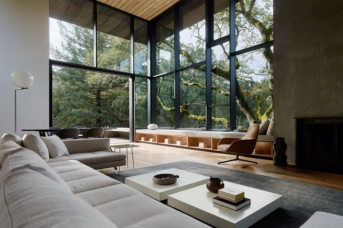 Tall and spacious living room opening up to a patio and garden surrounded with mature oak trees, Orinda, Contra Costa County, California